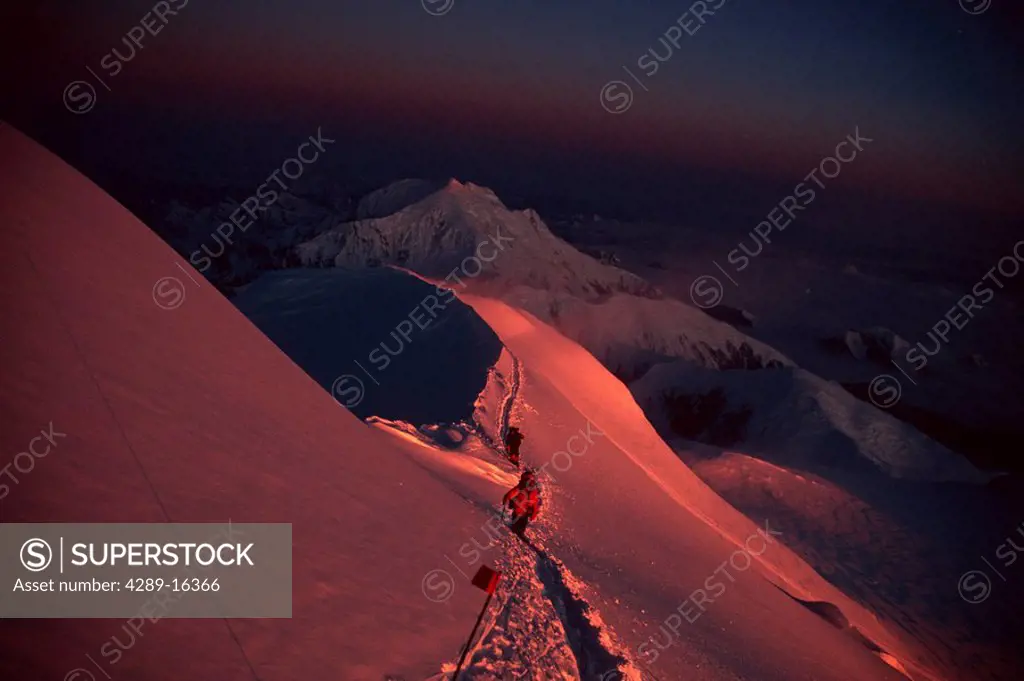 Climbers Denali Summit Ridge Denali NP Interior AK sunset winter scenic