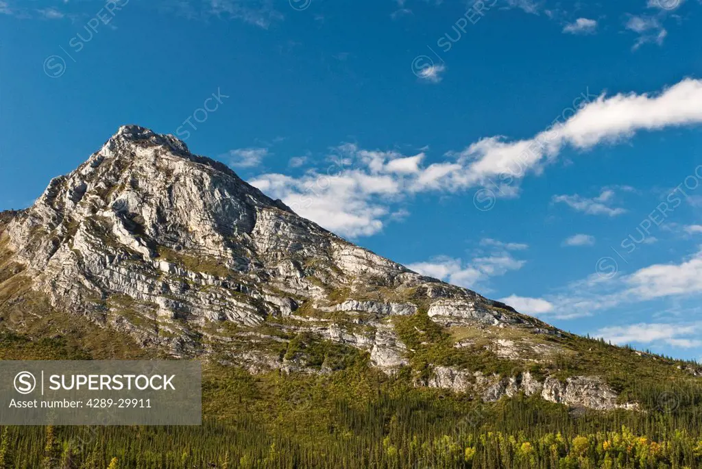 Massive granite peaks rise above the Alatna River in Gates of the Arctic National Park & Preserve, Brooks Range, Arctic Alaska, Fall