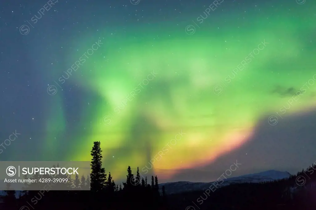 Northern Lights above the Parks Highway just north of the Denali National Park Entrance, Digitaly Enhanced, Winter, Interior Alaska, USA.