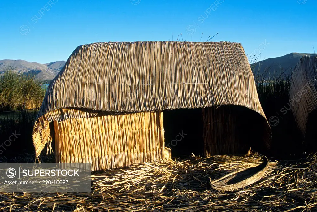 Model of Uro Indian totora reed house on bank of Lake Titicaca, in grounds of Hotel Posada del Inca, Puno, Peru