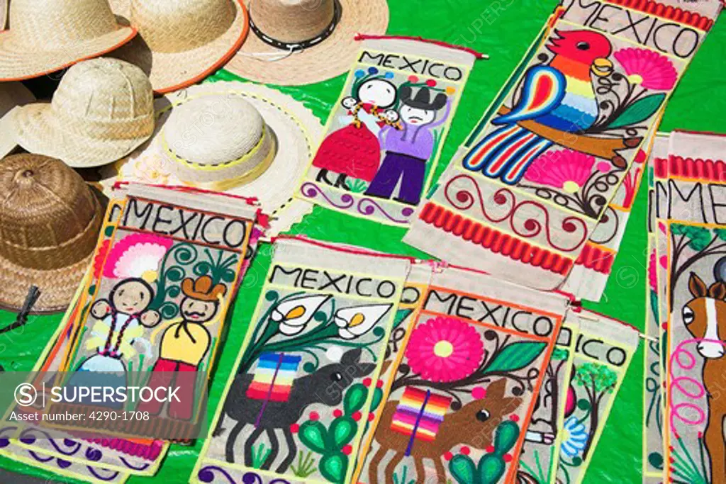 Hats and embroidered Mexican wall hanging souvenirs for sale, Zocalo, Mexico City, Mexico