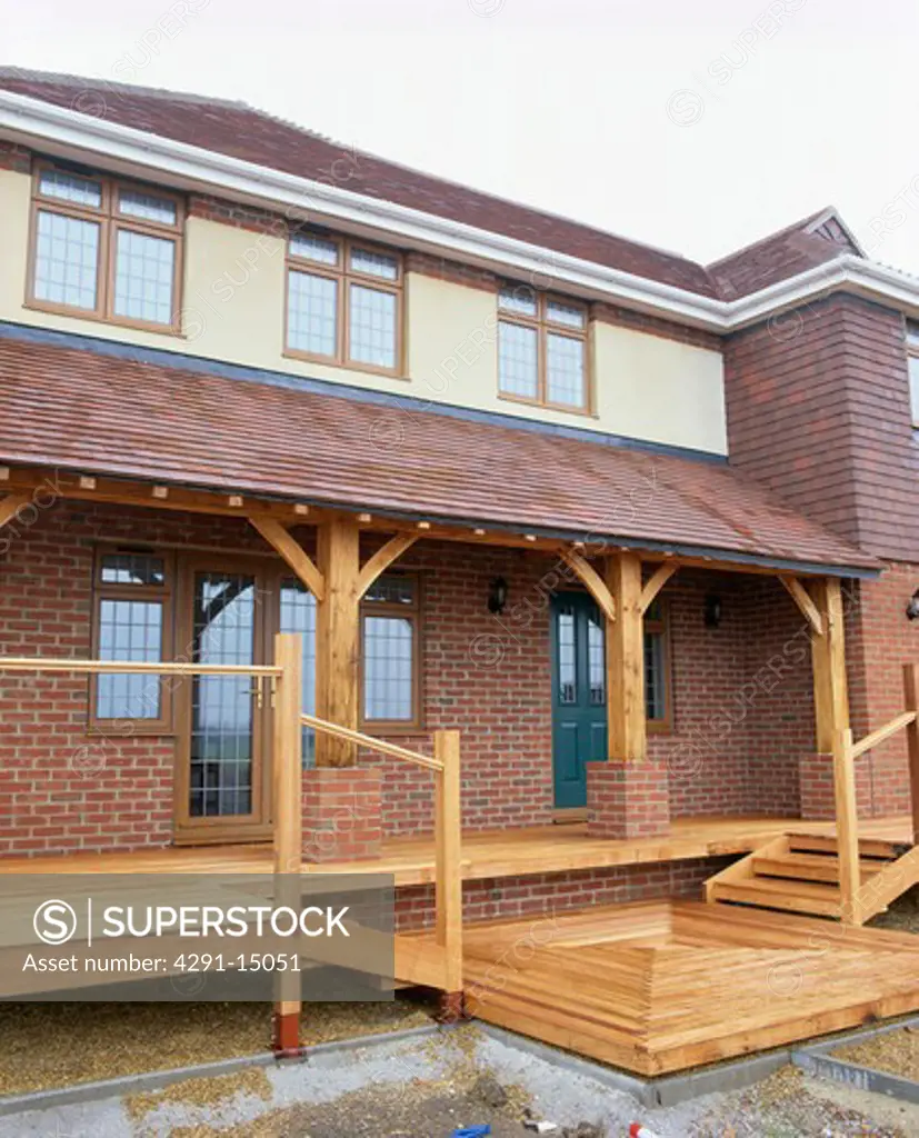 Newly-built brick house with wooden decked veranda