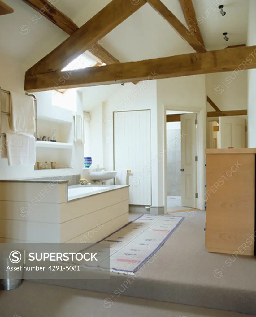 Beamed apex roof in modern white country bathroom