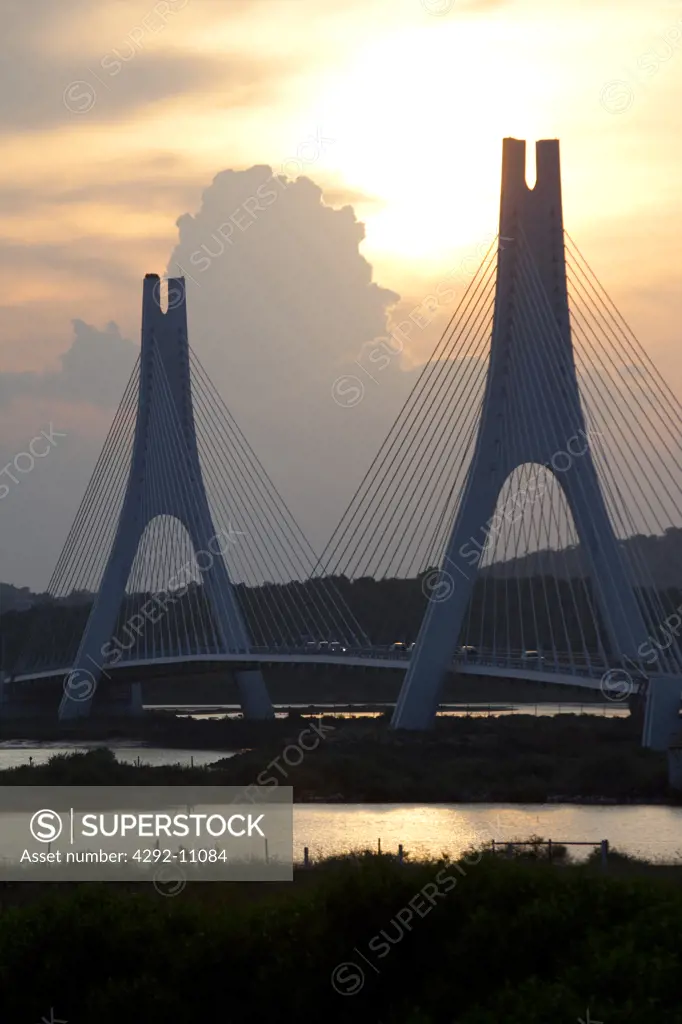 Portugal, Algarve, Portimao, the Portimao suspension bridge over River Arade at sunset