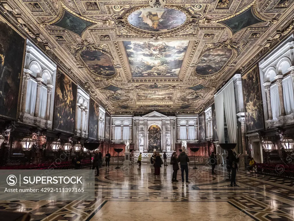 Italy, Veneto, Venice, Scuola Grande di San Rocco, tourists admire the works of Tintoretto in the school of the sacred Rochus