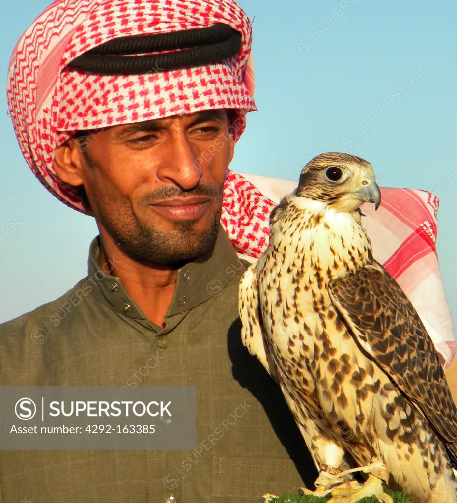 Bedouin with hawk, Arabian desert, Saudi Arabia