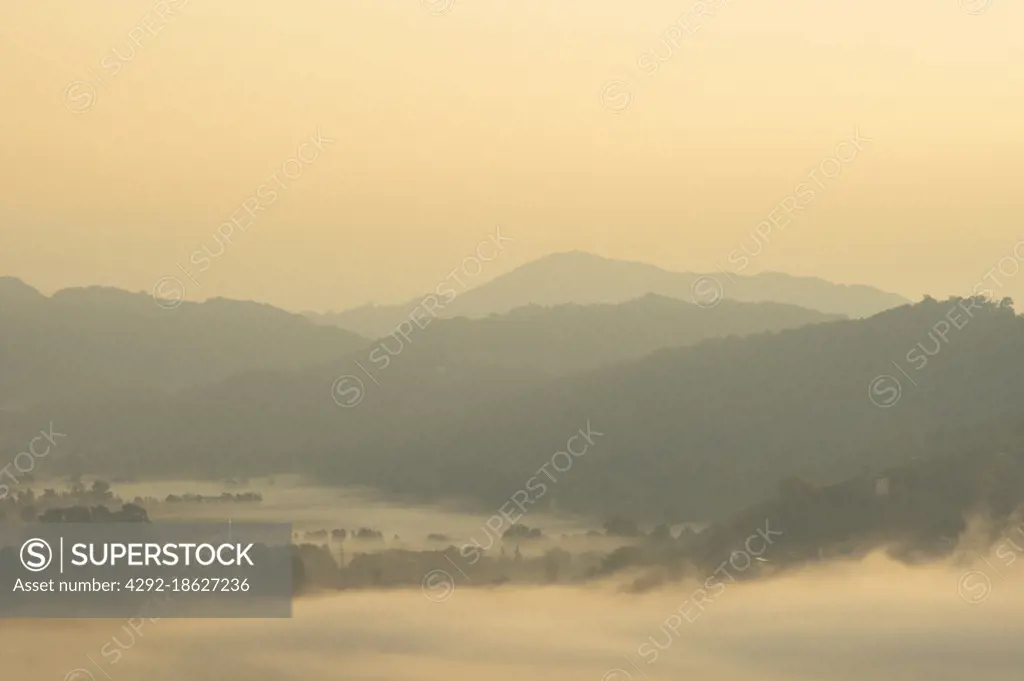 Italy, Veneto, Cison di Valmarino, landscape at sunrise from Brando Castle