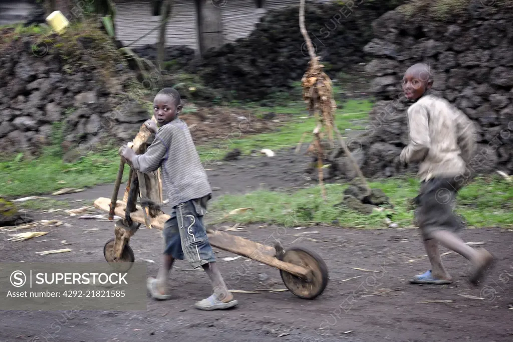 Democratic Republic of Congo, North Kivu region, Children playing with chukudu