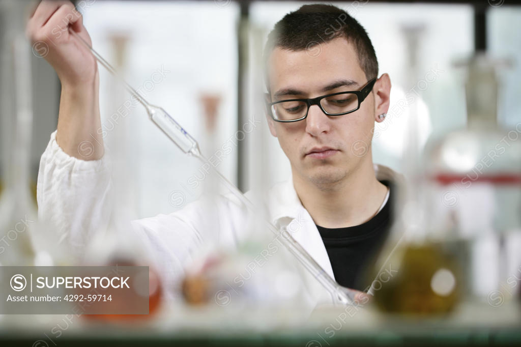 Worker in chemistry laboratory - SuperStock