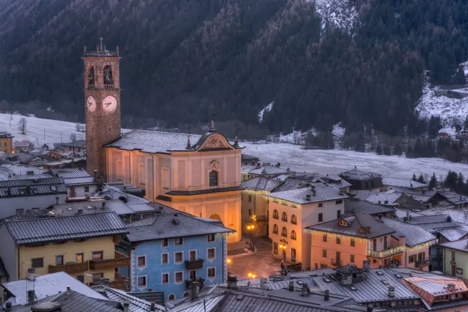 Italy, Lombardy, Retiche Alps, Camonica Valley, Adamello Regional Park mountains and Temù-Ponte di Legno ski area from Vezza d'Oglio (fg.: San Martino Parish Church)