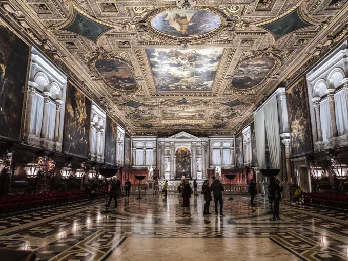 Italy, Veneto, Venice, Scuola Grande di San Rocco, tourists admire the works of Tintoretto in the school of the sacred Rochus