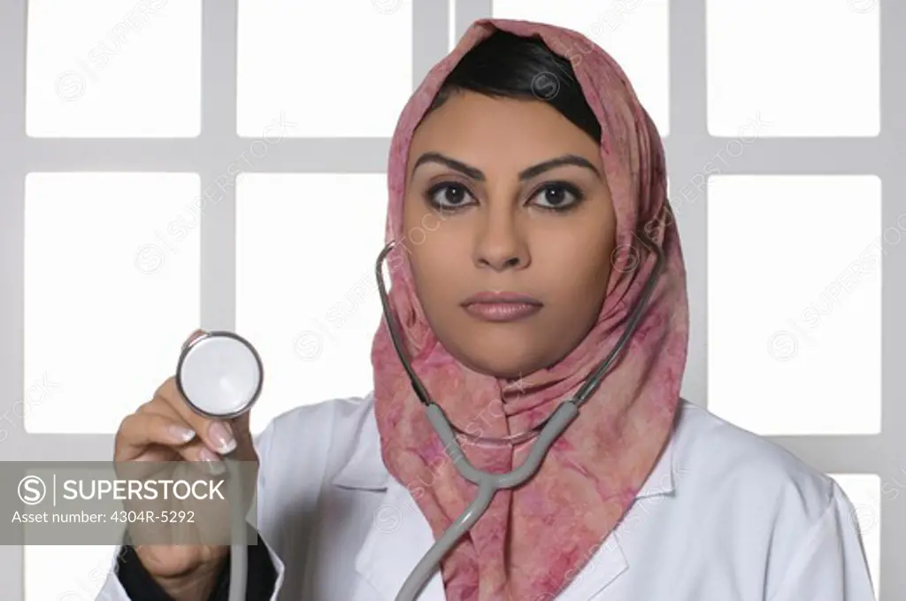 Female doctor wearing stethoscope, portrait