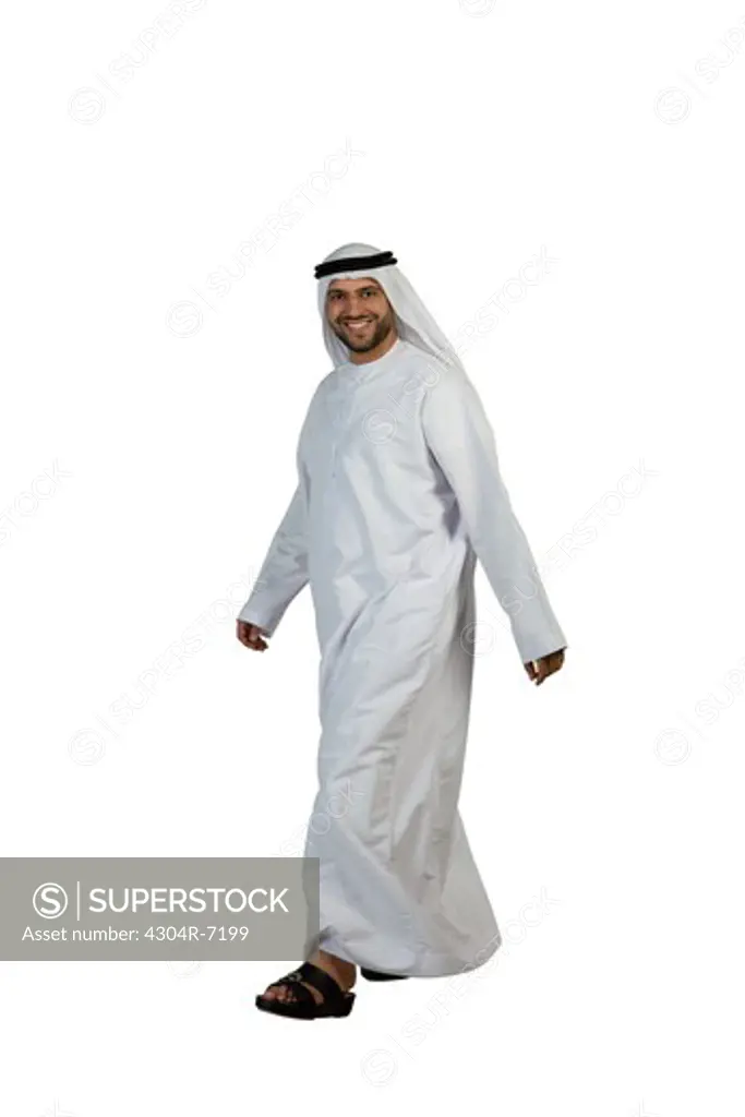 Arab man walking, smiling