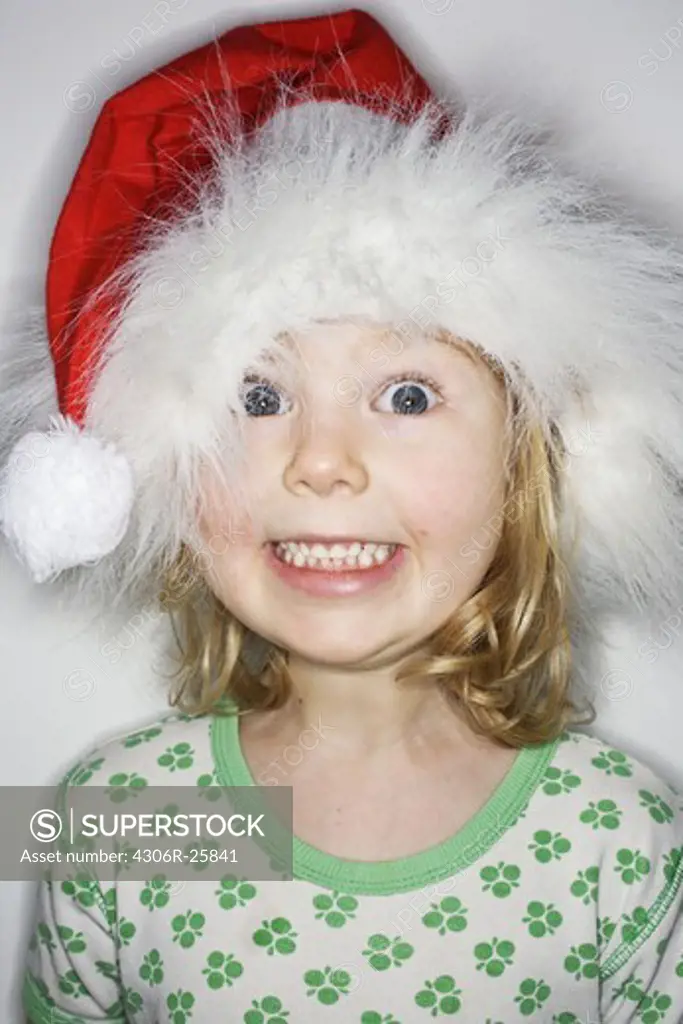 Studio portrait of girl wearing santa hat