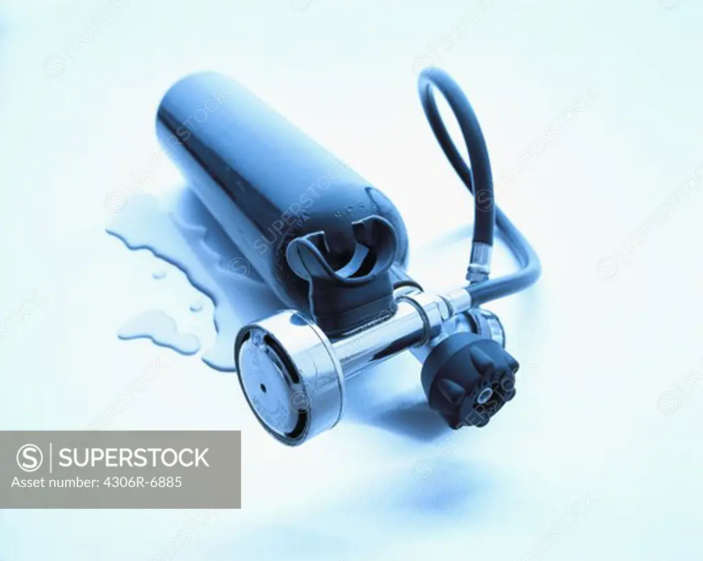 Oxygen tank with drops of water on blue background