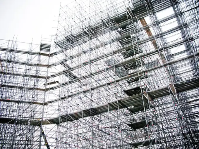 Building with scaffolding at construction site