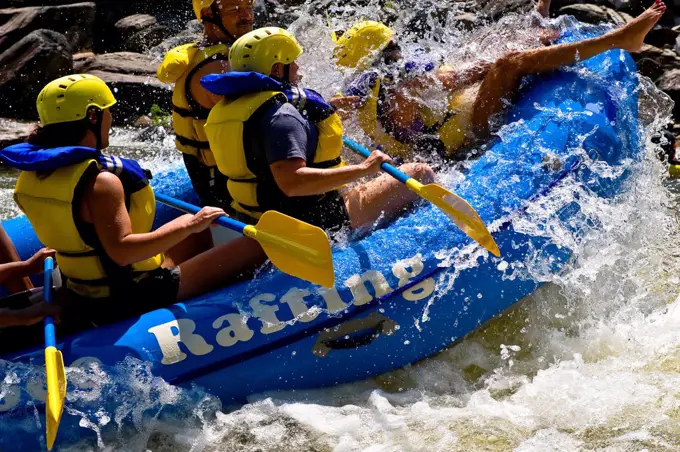 Group of Young People White-Water Rafting