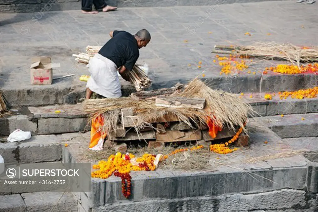 The body of a Hindu man is cremated at Pashupatinath Temple, near Kathmandu, Nepal.