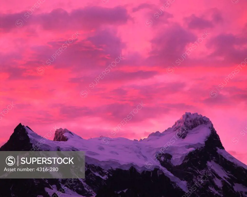 Roseate Sunset Light on Clouds Above the Summit of Cerro Paine Grande