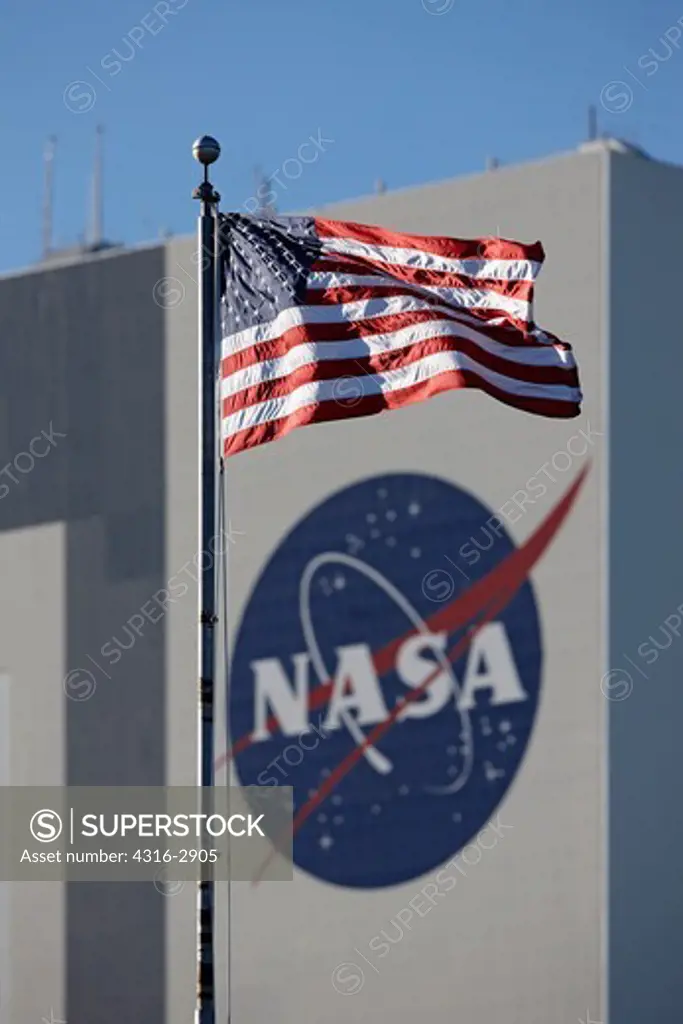 The American flag flies below the Vehicle Assembly Building, Kennedy Space Center, Florida.