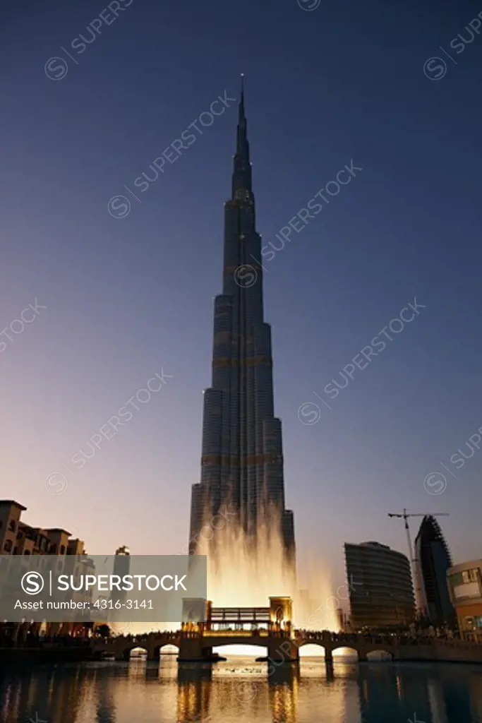 A dusk view of the Burj Khalifa during a display of the Dubai Fountain, Dubai, United Arab Emirates.