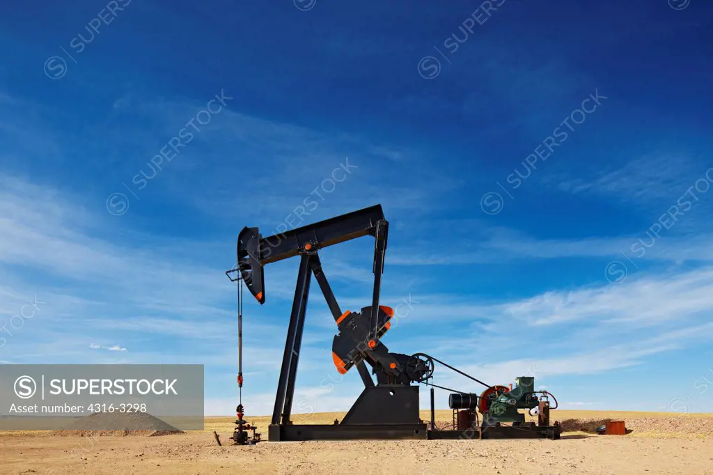 An oil  well pump jack in northeastern Colorado. A pump jack is also known as a pumpjack, a pumping unit, a grasshopper pump, and a jack pump, among other names.