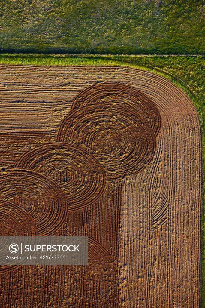 An aerial view of farm land, with circular plow lines, on the eastern Colorado Plains.