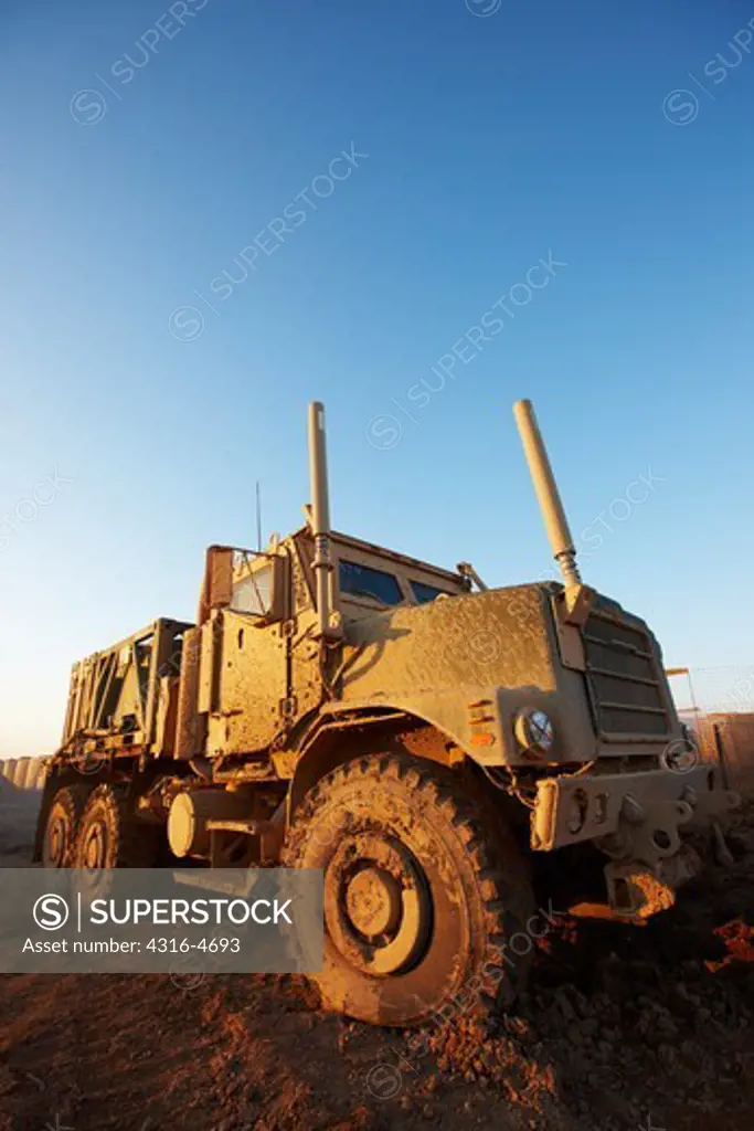 MTVR, or Medium Tactical Vehicle Replacement, also known as a Seven Ton Transport, in thick mud at a small, remote, austere United States Marine Corps combat outpost in Afghanistan's Helmand Province
