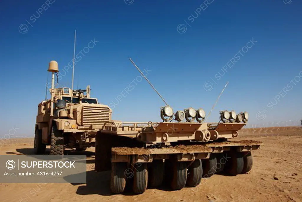 MRAP, or mine resistant ambush protected vehicle, fitted with a mine roller, at a remote, austere United States Marine Corps combat outpost in Afghanistan's Helmand Province