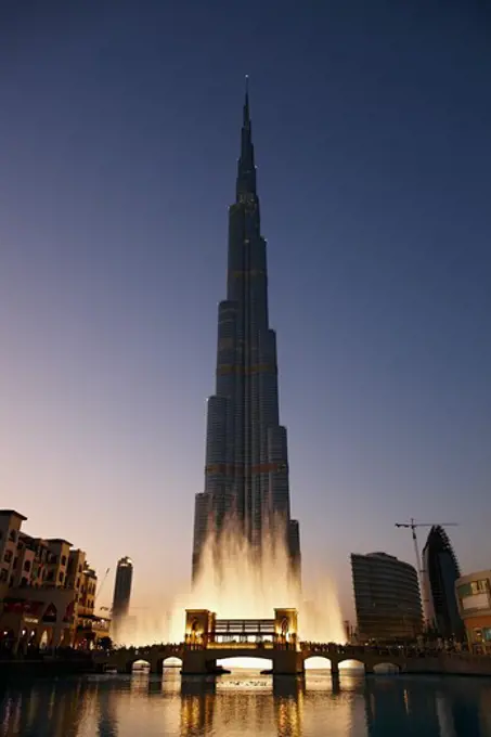 A dusk view of the Burj Khalifa during a display of the Dubai Fountain, Dubai, United Arab Emirates.