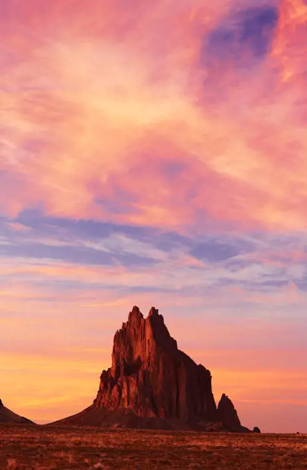 USA, New Mexico, Navajo Nation, Silhouette of Ship Rock at dusk