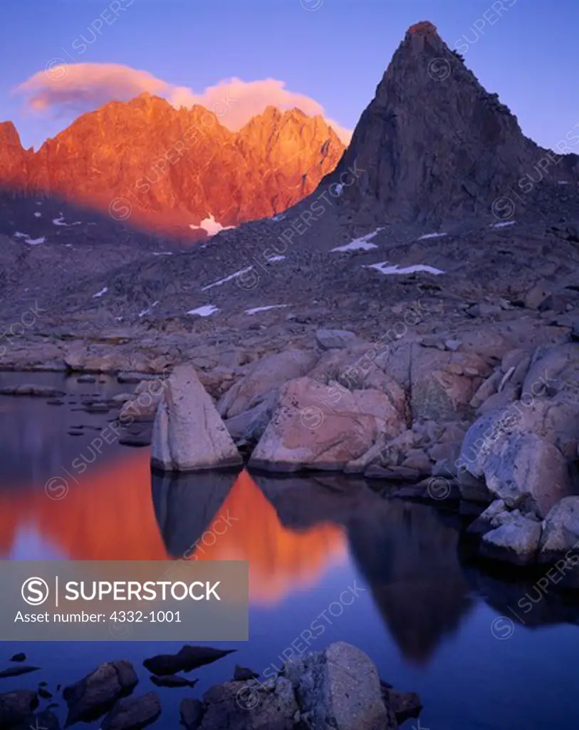 Thunderbolt Peak, North Palisade and Isosceles Peak reflected at sunset in one of the Dusy Lakes, Dusy Basin, Sierra Nevada, Kings Canyon National Park, California.