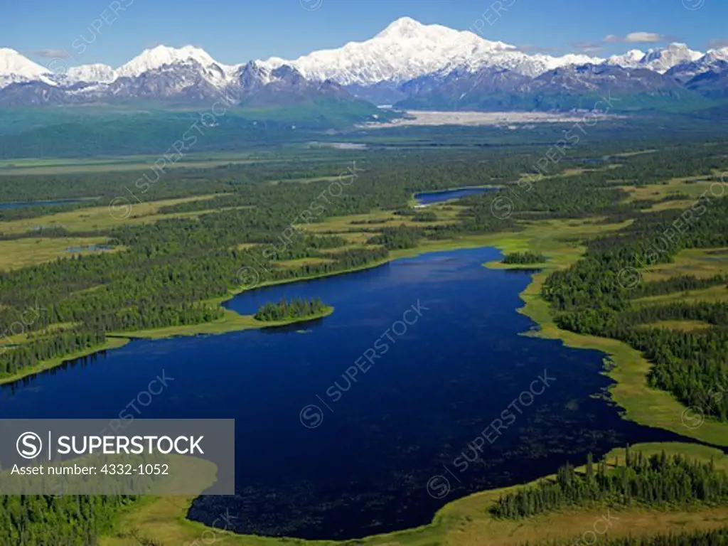 Aerial view of Moosemeyer Lake on the southern end of Denali State Park with Mt. McKinley or Denali beyond, Alaska.