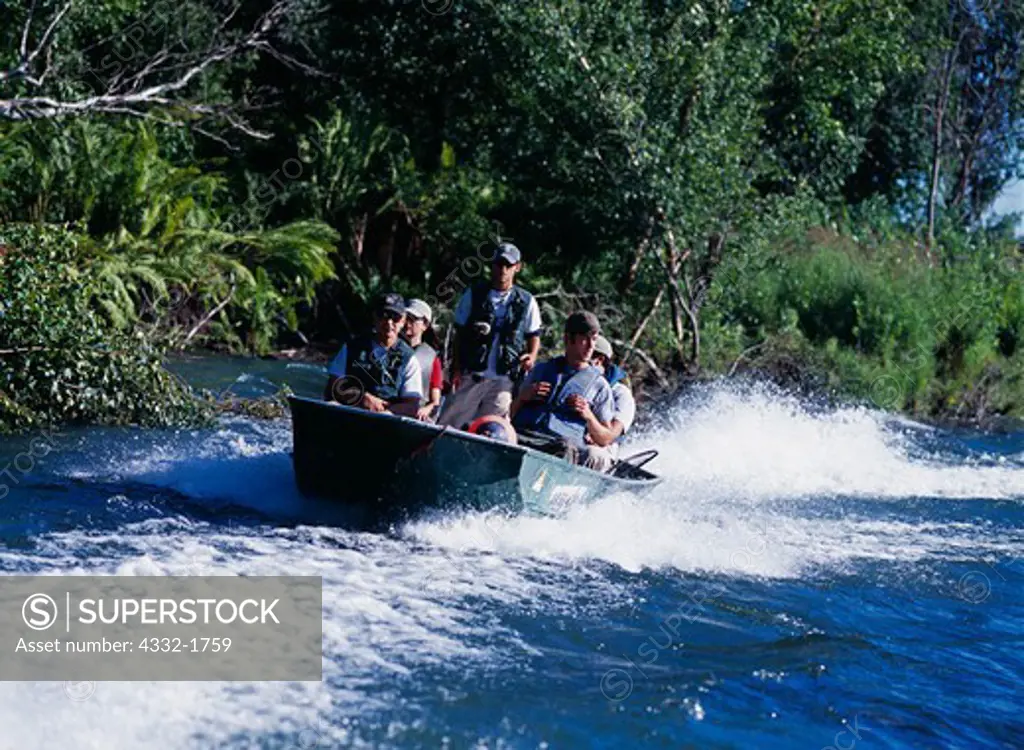 Chris Morin driving Riversong Lodge skiff with Tanya Miller, Carl Dixon, Daniel Holahan and John Tosch, Lake Creek, Alaska.