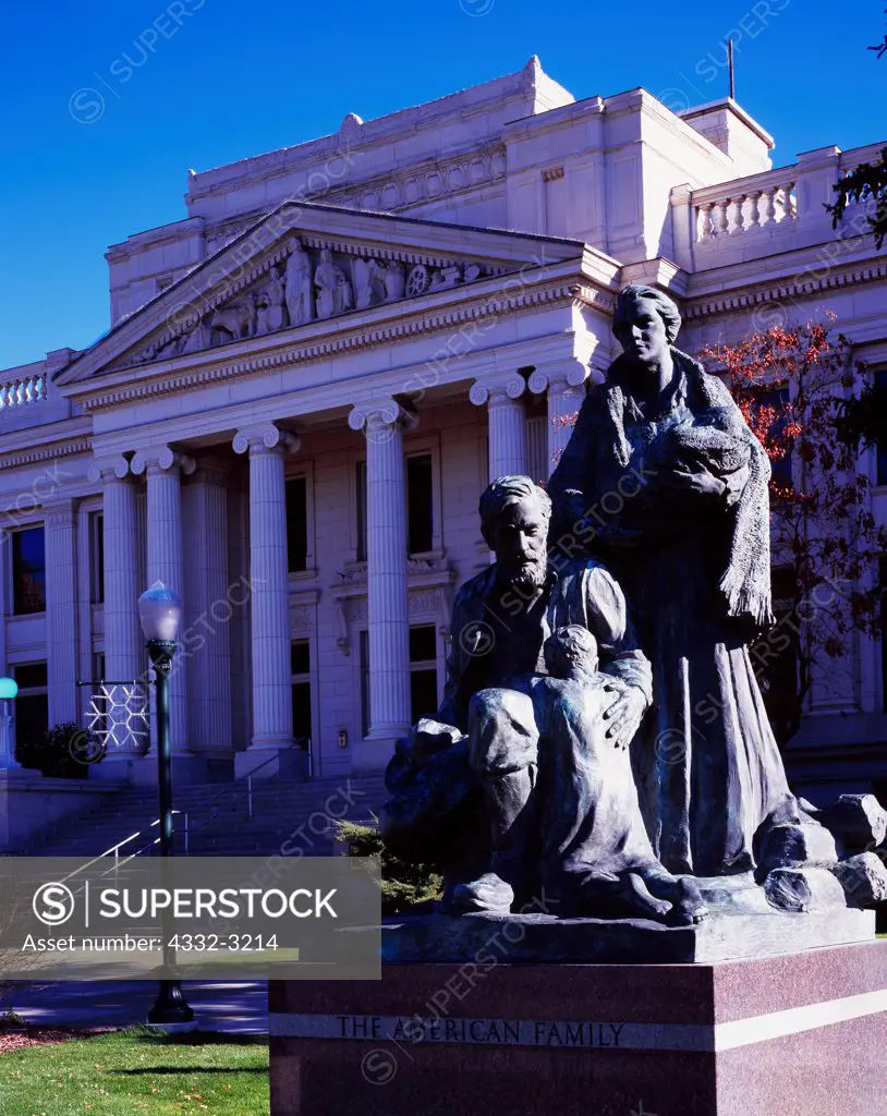 Historic Utah County Courthouse, built witth neoclassic design from 1919 to 1926 and statue 'The American Family', Provo, Utah.