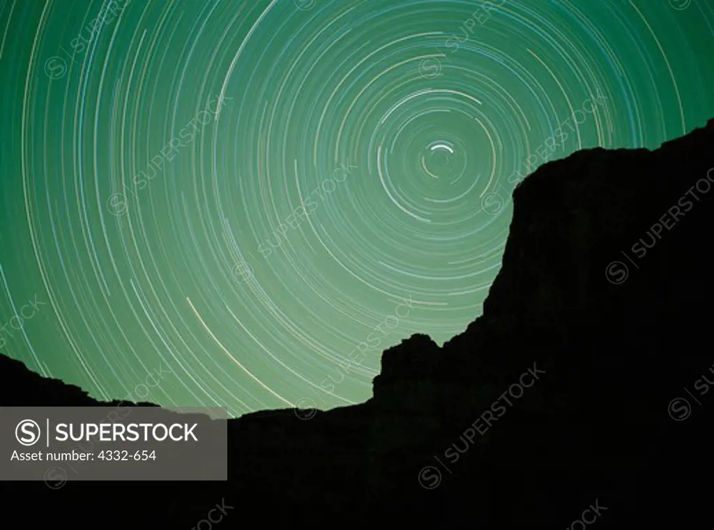 Night exposure of star trails circling Polaris, The North Star, above Butte Point near Blacktail Canyon, Grand Canyon, Grand Canyon National Park, Arizona.