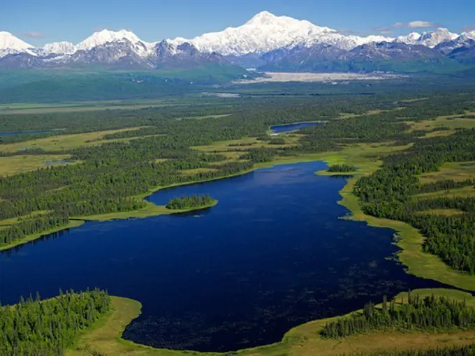 Aerial view of Moosemeyer Lake on the southern end of Denali State Park with Mt. McKinley or Denali beyond, Alaska.