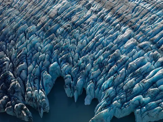 Aerial view of crevasses and seracs at the face of Colony Glacier, Lake George, Alaska.