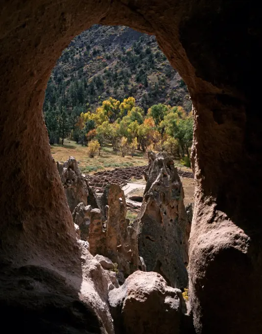 Natural arch framing Tyuonyi Ruin dating from A.D. 1383 to 1466, Frijoles Canyon, Bandelier National Monument, New Mexico.