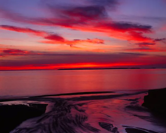 Glorious red sunset over Lake Superior, Lake Superior Provincial Park, Ontario, Canada.