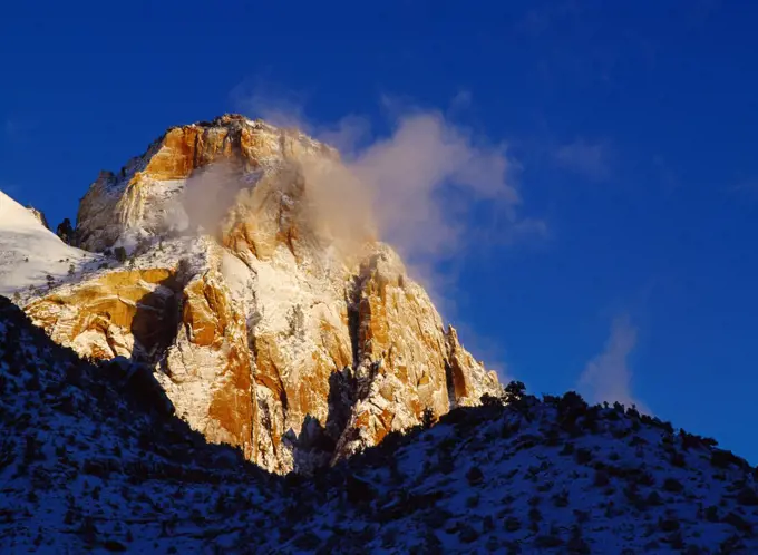 Sunrise on the Sentinel following a winter storm, Zion National Park, Utah.