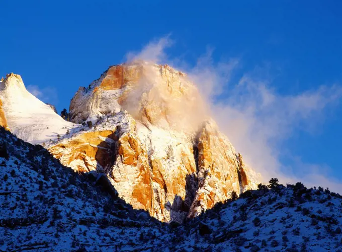 Sunrise on the Sentinel following a winter storm, Zion National Park, Utah.