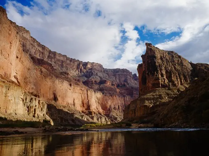 Mottled sunlight on wall of Marble Canyon upstream from Nankoweap, Grand Canyon National Park and Navajo Reservation, Arizona.