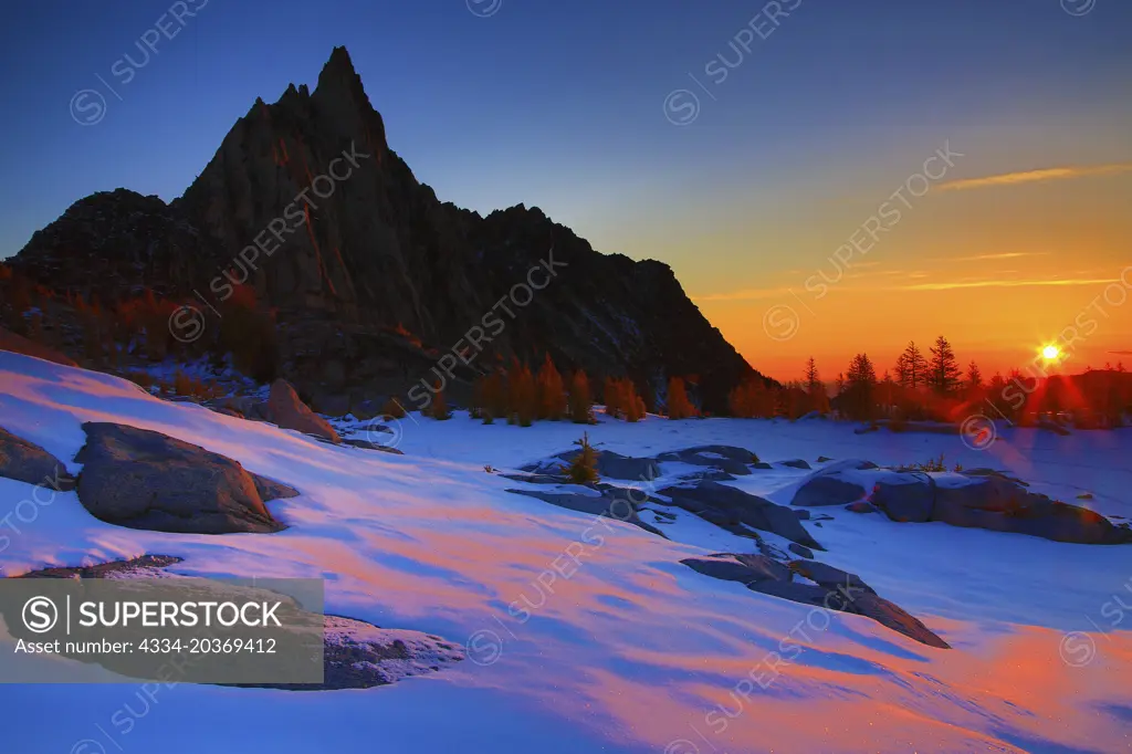 Sunrise Prusik Peak Over a Frozen Gnome Tarn in The Enchantments in The Apline Lakes Wilderness of Washington