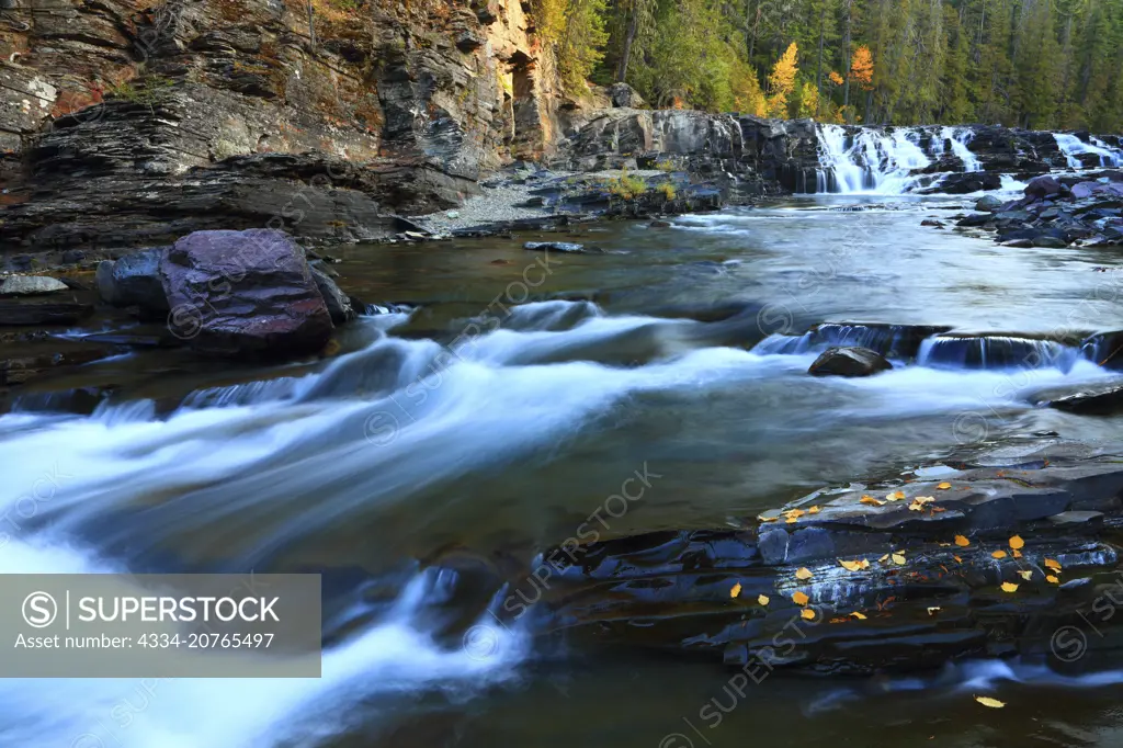 Fall Color and McDonald Falls on McDonald Creek in Glacier National Park in The Rocky Mountains of Montana