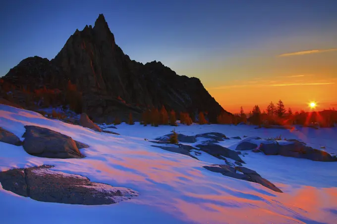 Sunrise Prusik Peak Over a Frozen Gnome Tarn in The Enchantments in The Apline Lakes Wilderness of Washington