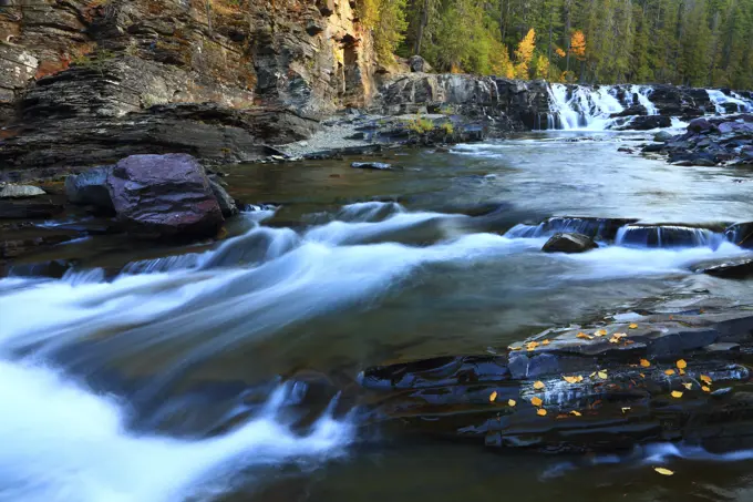 Fall Color and McDonald Falls on McDonald Creek in Glacier National Park in The Rocky Mountains of Montana