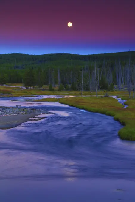 Sunset Alpenglow and Full Moon Over the Madison and Gibbon River Confluence in Yellowstone National Park in Wyoming