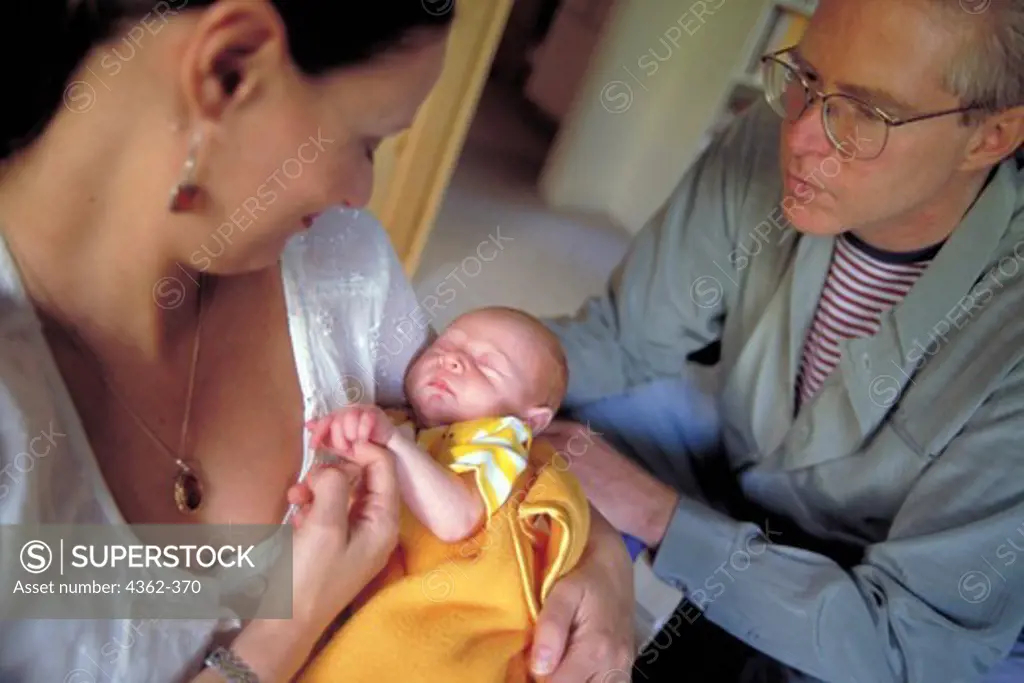 Parents Admire Newborn Baby