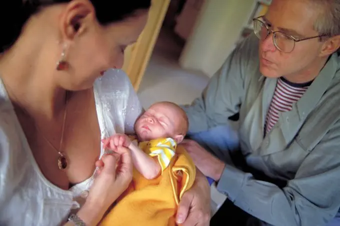 Parents Admire Newborn Baby